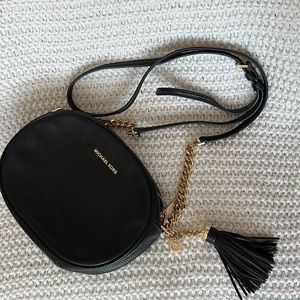 Micheal Kors Black Leather Handbag with Gold Hardware Oval Shape Zipper Closure